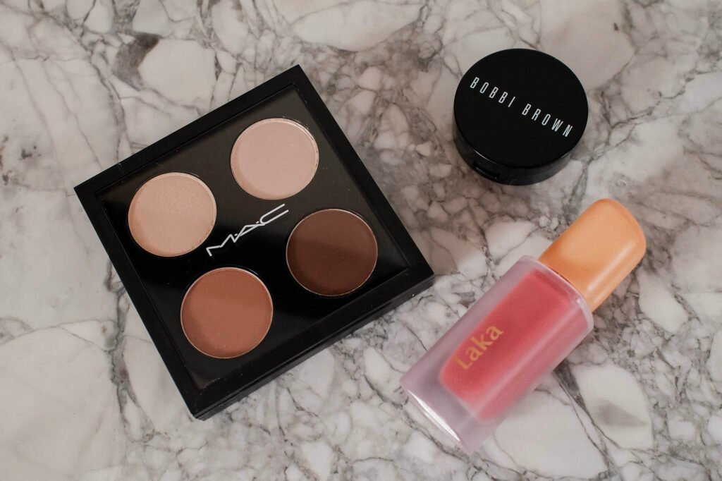 Mac custom palette of eyeshadows including Brule, Shroom, Wedge and Espresso, a Bobbi Brown colour corrector and Laka Fruity Glam Lip Tint