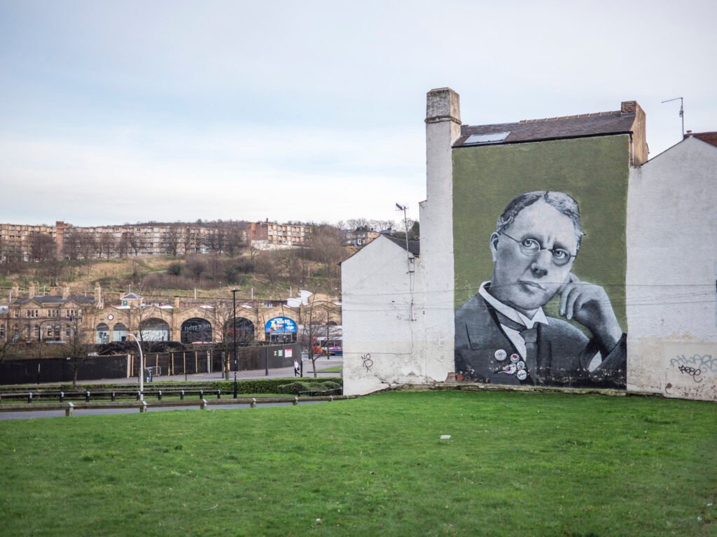 Sheffield street art with a view over the train station and Park Hill flats