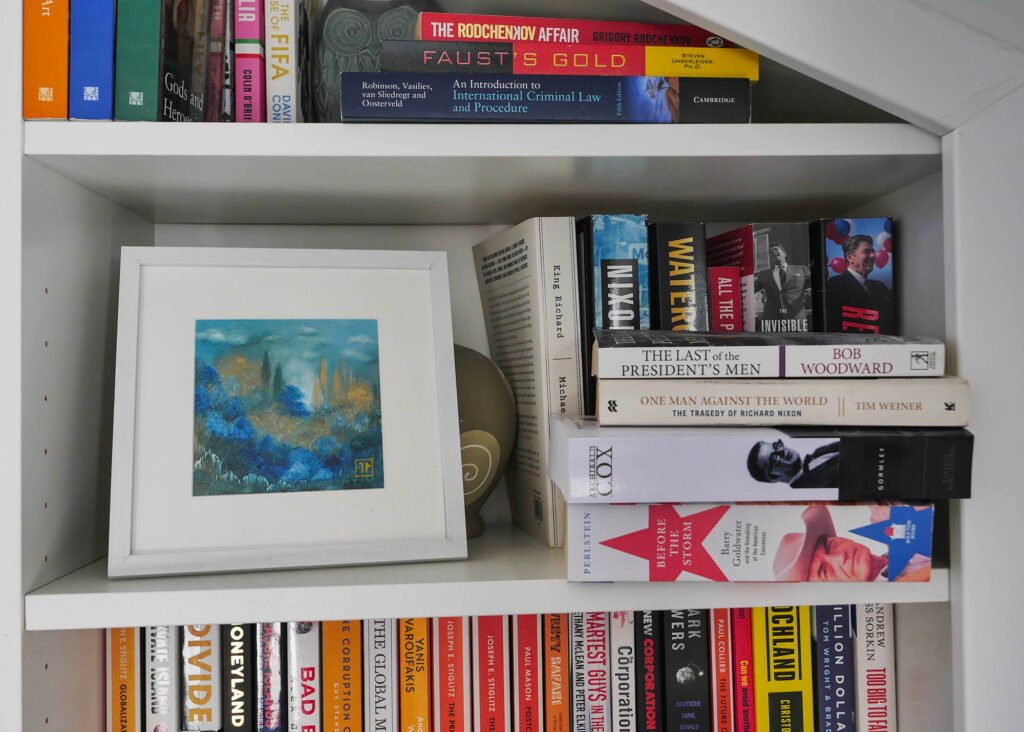 Oil painting by French artist Joëlle Rhode on a bookshelf