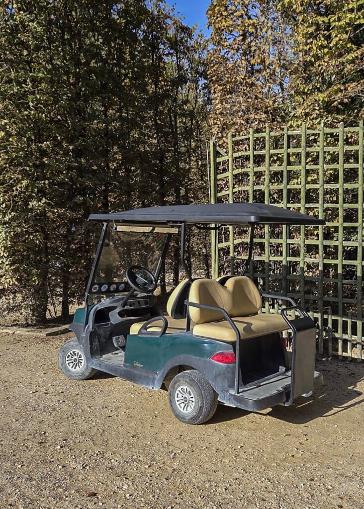 Golf cart parked in the grounds of Versailles