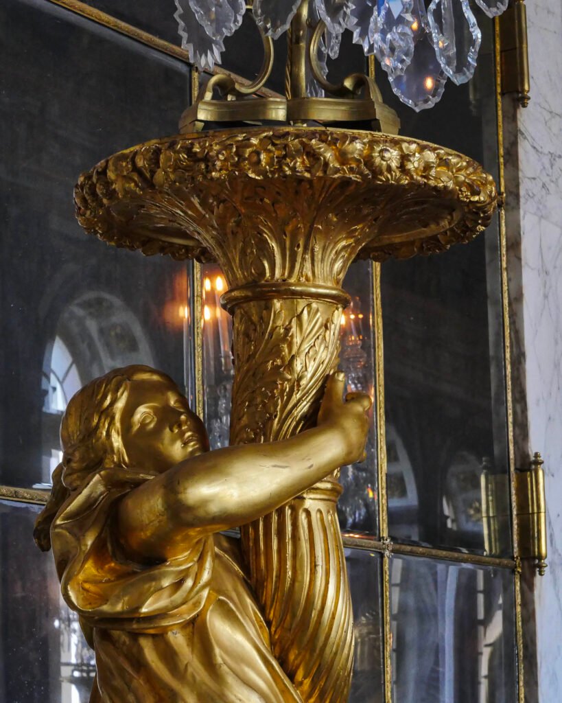One of the chandelier holders at Versailles in the Hall of Mirrors